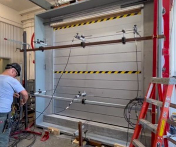 Aquaverter flood barrier evaluated under dynamic water and wave simulation